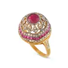 A RUBY AND DIAMOND DRESS RING in silver gilt, the domed ring set with a round cut ruby, accented