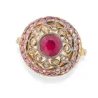 A RUBY AND DIAMOND DRESS RING in silver gilt, the domed ring set with a round cut ruby, accented