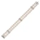 MIKIMOTO, A FINE AKOYA PEARL AND DIAMOND BRACELET in 18ct white gold, comprising two rows of pearls,