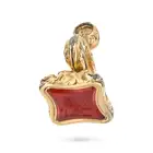 AN ANTIQUE CARNELIAN FOB SEAL / PENDANT the scrolling foliate style pendant set with a carnelian