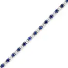 MAPPIN & WEBB, A SAPPHIRE AND DIAMOND LINE BRACELET in 18ct white gold, comprising a row of