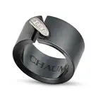 CHAUMET, A DIAMOND AND CERAMIC LIENS RING the black ceramic band accented by a stitch motif set with