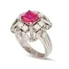 A RUBY AND DIAMOND DRESS RING set with a mixed cut ruby of approximately 1.88 carats, accented by