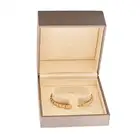 BULGARI, A GOLD SERPENTI VIPER BANGLE in 18ct yellow gold, the articulated bangle designed as a