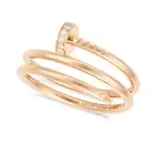 CARTIER, A DIAMOND JUSTE UN CLOU DOUBLE RING in 18ct rose gold, designed as a bent nail, accented by