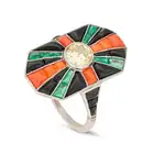 AN ART DECO DIAMOND, CORAL, ONYX AND EMERALD DRESS RING set with a round brilliant cut diamond of