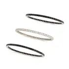 THREE ART DECO ONYX AND DIAMOND BANGLES, EARLY 20TH CENTURY one set all around with a row of old