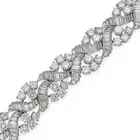 A FINE VINTAGE DIAMOND BRACELET, CIRCA 1950'S comprising a row of scrolling links set with