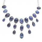NO RESERVE - A SAPPHIRE FRINGE NECKLACE in silver, comprising a graduating row of oval faceted