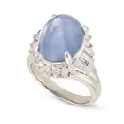 NO RESERVE - A 13.03 CARAT STAR SAPPHIRE AND DIAMOND RING set with a cabochon star sapphire of 13.03