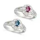 NO RESERVE - A BRAZILIAN ALEXANDRITE AND DIAMOND RING set with an oval cut alexandrite of 0.50