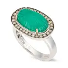 A CARVED EMERALD AND DIAMOND RING set with a carved cabochon emerald of 4.69 carats, within a border