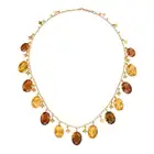AN ANTIQUE CITRINE FRINGE NECKLACE comprising a trace suspending a fringe of oval cut citrines and