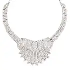 A DIAMOND COLLAR NECKLACE in silver, the stylised scrolling necklace set throughout with round