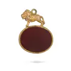NO RESERVE - THREE ANTIQUE PENDANTS comprising a pendant set with a hessonite garnet, accented by