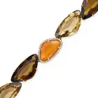 VIANNA, A SMOKY QUARTZ, CITRINE, CARNELIAN AND DIAMOND BRACELET comprising a row of mixed cut