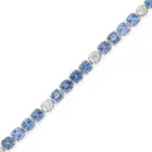 OSCAR FRIEDMAN, A SAPPHIRE AND DIAMOND LINE BRACELET set with a row of cushion cut sapphires,