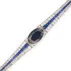 ATTR. MAUBOUSSIN, AN ART DECO SAPPHIRE AND DIAMOND BRACELET set with an oval cut sapphire of