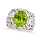 A PERIDOT AND DIAMOND RING AND EARRINGS SUITE the ring set with an oval cut peridot of approximately