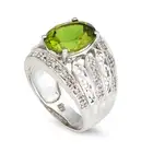 A PERIDOT AND DIAMOND RING AND EARRINGS SUITE the ring set with an oval cut peridot of approximately