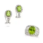 A PERIDOT AND DIAMOND RING AND EARRINGS SUITE the ring set with an oval cut peridot of approximately