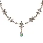 AN ANTIQUE DIAMOND AND BLACK PEARL PENDANT NECKLACE the necklace in foliate design, set throughout