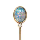 AN ANTIQUE BLACK OPAL AND DIAMOND STICK / TIE PIN BROOCH in yellow gold, set with an oval cabochon