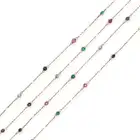 NO RESERVE - A MULTI GEM CHAIN NECKLACE comprising a trace chain set with round cut rubies,