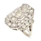 AN ART DECO DIAMOND DRESS RING the geometric ring set with three principal old European cut