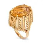 A VINTAGE CITRINE RING in 18ct yellow gold, set with an oval cut citrine, the stylised gallery