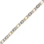 A VINTAGE PEARL AND DIAMOND BRACELET in platinum and white gold, comprising a row of round brilliant