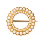 NO RESERVE - AN ANTIQUE VICTORIAN NATURAL PEARL CIRCLE BROOCH, 19TH CENTURY in yellow gold, designed