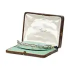 AN ANTIQUE DIAMOND TIARA / BRACELET, EARLY 20TH CENTURY in platinum and 18ct yellow gold, comprising