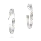 CARTIER, A PAIR OF LOVE HOOP EARRINGS in 18ct white gold, each hoop punctuated by screw head motifs,