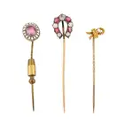 NO RESERVE - A COLLECTION OF FOUR ANTIQUE STICK PINS comprising a paste horse shoe stick pin 1.
