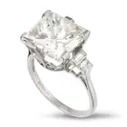 A 9.01 CARAT DIAMOND RING in platinum, set with a rectangular modified brilliant cut diamond of 9.01