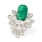 AN EMERALD AND DIAMOND COCKTAIL RING set with a polished emerald drop within a tiered spray of round