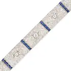 AN ART DECO SAPPHIRE AND DIAMOND STRAP BRACELET comprising a row of pierced geometric links set with