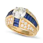 OSCAR HEYMAN, A FINE DIAMOND AND SAPPHIRE DRESS RING set with a round brilliant cut diamond of 2.