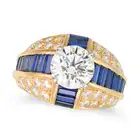 OSCAR HEYMAN, A FINE DIAMOND AND SAPPHIRE DRESS RING set with a round brilliant cut diamond of 2.
