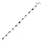 A RUBY AND DIAMOND BRACELET comprising a row of fancy links, set with oval cut rubies accented by