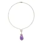 A FINE VINTAGE AMETHYST, DIAMOND AND PEARL PENDANT NECKLACE the pendant comprising a large carved
