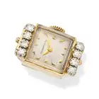 A DIAMOND WATCH RING the rectangular dial signed Tiffany & Co. with baton hour markers, set to the