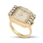 A DIAMOND WATCH RING the rectangular dial signed Tiffany & Co. with baton hour markers, set to the
