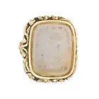 AN ANTIQUE AGATE FOB SEAL / PENDANT in foliate design, set with an agate intaglio carved to depict a