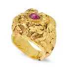 A RUBY DRESS RING the highly ornate band featuring animals in high relief figures and scrollwork,