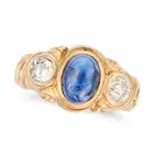 AN ANTIQUE SAPPHIRE AND DIAMOND RING in yellow gold, set with a cabochon sapphire of approximately