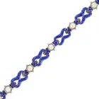 AN ANTIQUE PEARL, ENAMEL AND DIAMOND BRACELET in yellow gold and silver, comprising links relieved