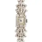 A RETRO DIAMOND COCKTAIL WATCH the rectangular face with Arabic numerals, within a border of