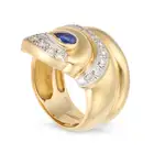 NO RESERVE - A SAPPHIRE AND DIAMOND SNAKE RING in 14ct yellow gold, designed as a coiled snake,